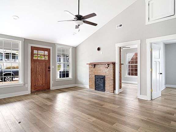 Living room and the front door, which opens onto Jarnigan