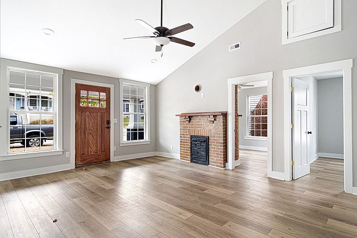 Living room and the front door, which opens onto Jarnigan