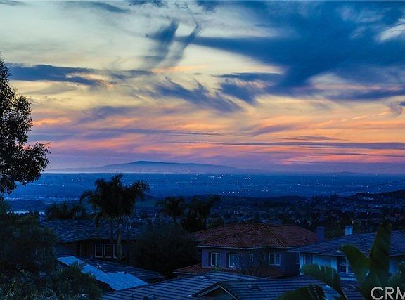 View of Palos Verdes and Long Beach harbor, the ocean as well as the sunset.