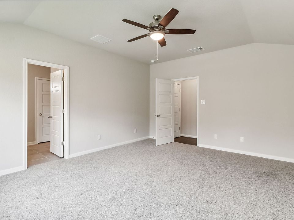 Primary suite in the Hughes floorplan at a Meritage Homes community.