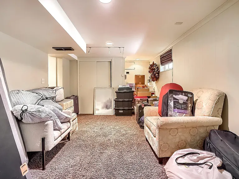 Basement den with 2 windows