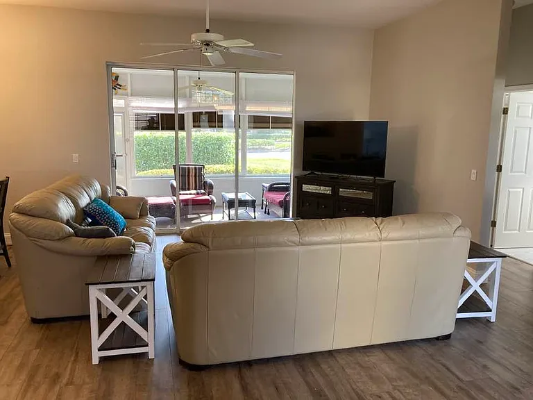 Great Room looks out on Florida room with sliding glass doors to open it up more.