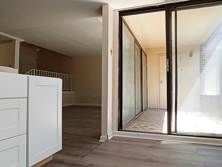 Balcony accessible through wall to ceiling doors in the kitchen