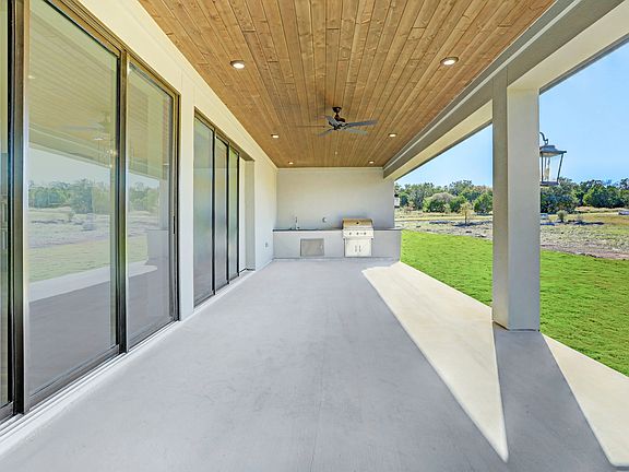 The covered patio offers plenty of space for relaxing and dining.