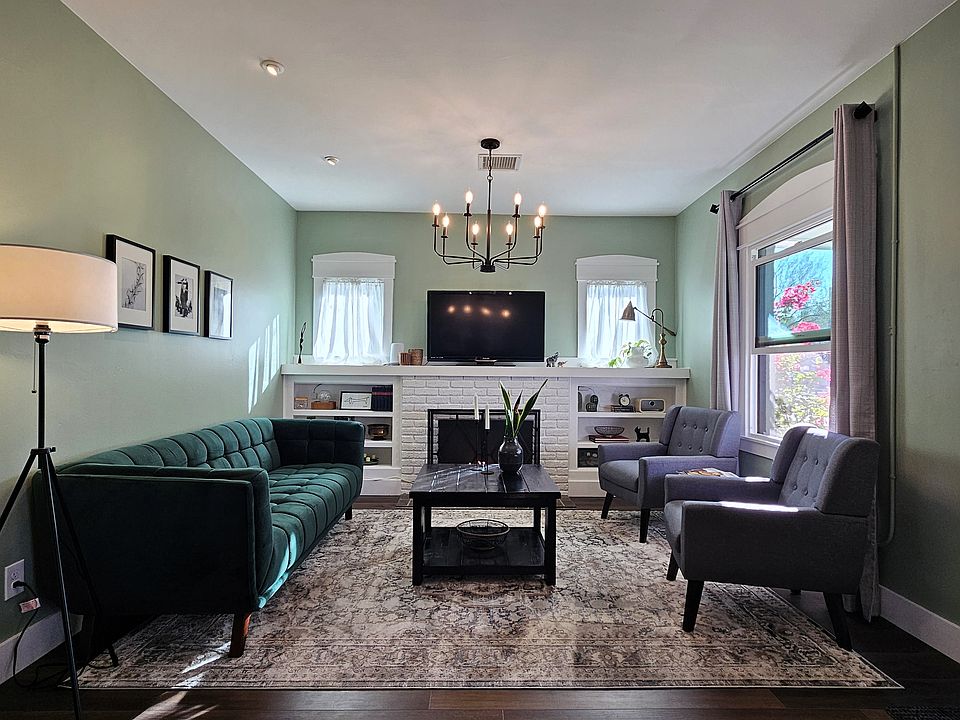 You'll love relaxing in the living room with stylish artwork, a smart tv with firestick and a Bluetooth speaker for your entertainment. The open layout flows seamlessly into the dining room, creating an open and welcoming space for you to enjoy.