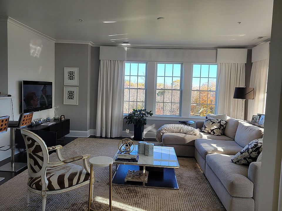 Living room boasts 2 walls o