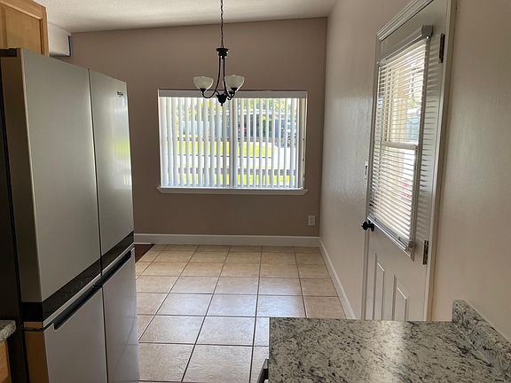 View from Kitchen of Dining room. approx. 7' x 8' with large window looking out over the front yard.