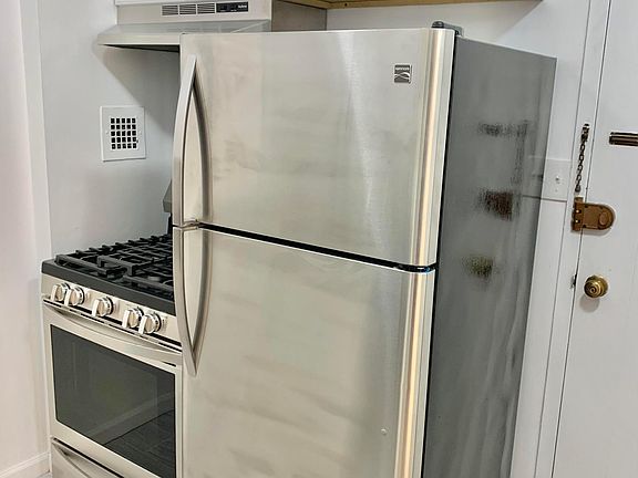 NEW STAINLESS STEEL STOVE RANGE, HOOD AND REFRIGERATOR
