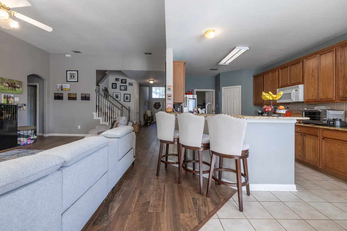 alternate view of the layout ( kitchen on the right, living area on the left, and the Great Room with a view of the front door. Stairs to the first floor, and entrance to the master bedroom at the bottom left beside the stairs) - 201 Del Cano Dr #201