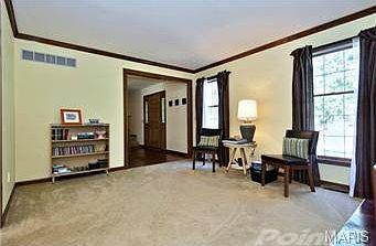 Formal living room with crown molding.
