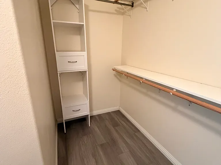 Primary walk-in closet.