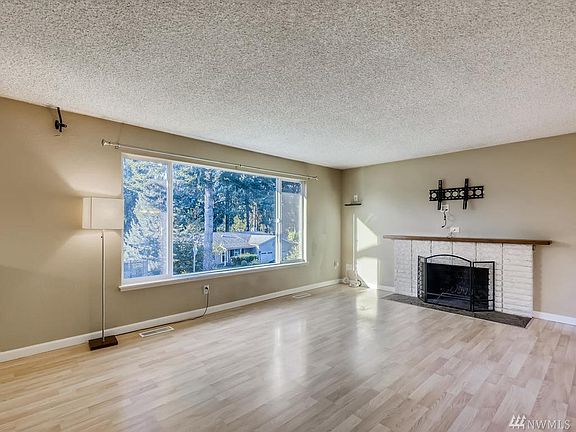 Large windows and a painted fireplace!  Ready for your TV!