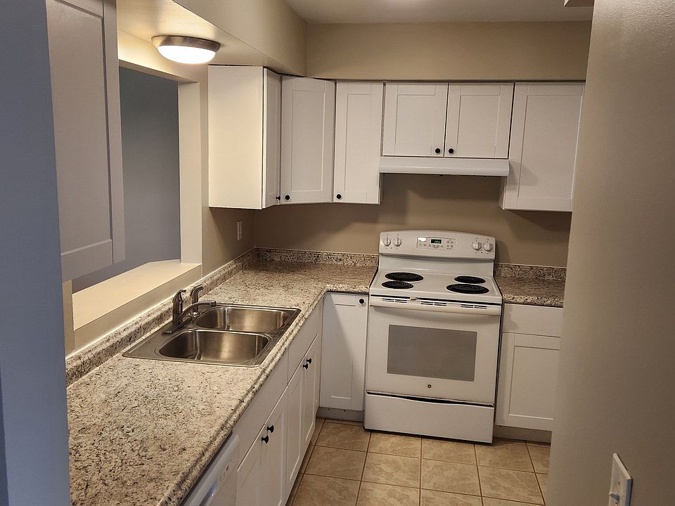 To right of front door entrance