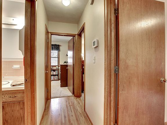 Hallway to 3 bedrooms and bath
