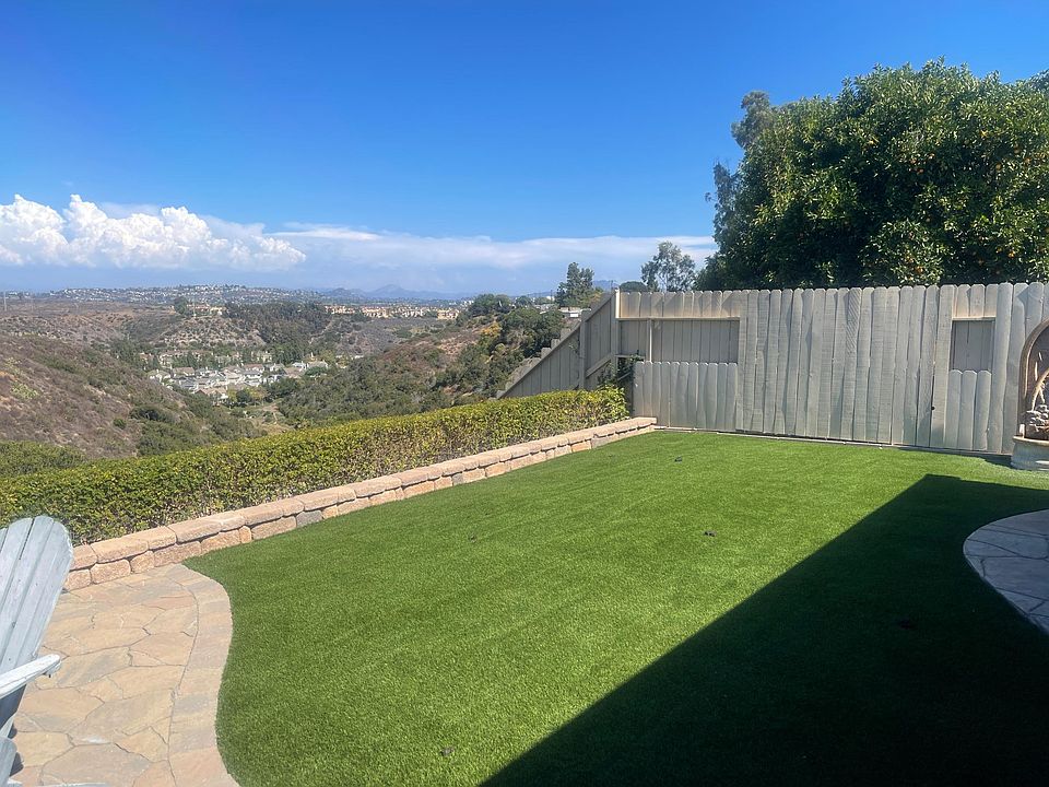 Backyard with views and new turf! Original fountain as well that works great. Sounds like a serene, mini stream in your backyard.