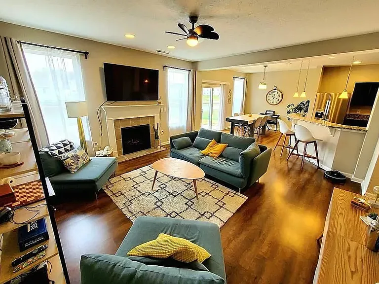 Living room open to kitchen and dining.