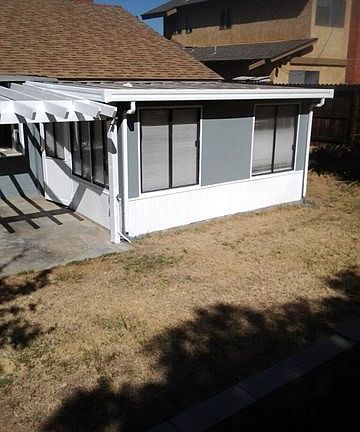 BACK PATIO SUN ROOM NEW CARPET AND PAINT