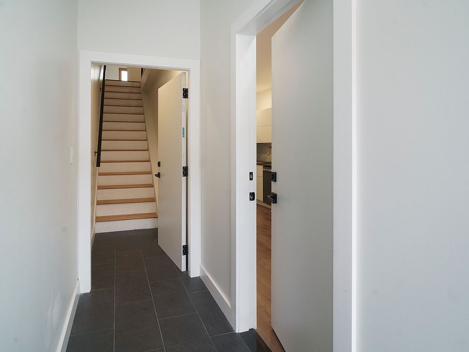 Building entryway - open entry door and stairway up to 2nd floor apartment - 1st floor apartment entry on the right in photo