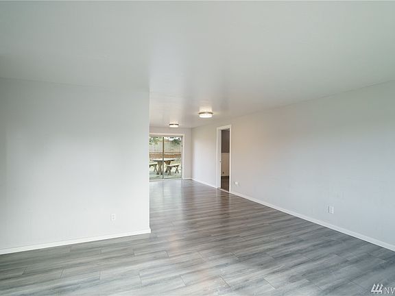 Step inside! Front living area and dining room to the rear. Bonus room to the right.