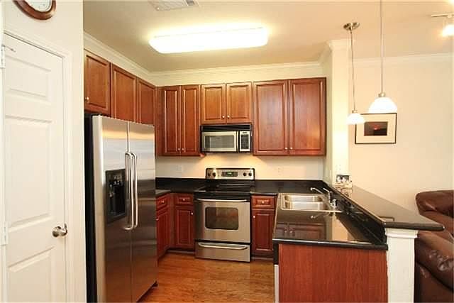Kitchen boasts all SS Appliances, hardwoods and granite counters.