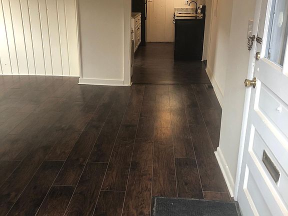 entrance door with view of kitchen