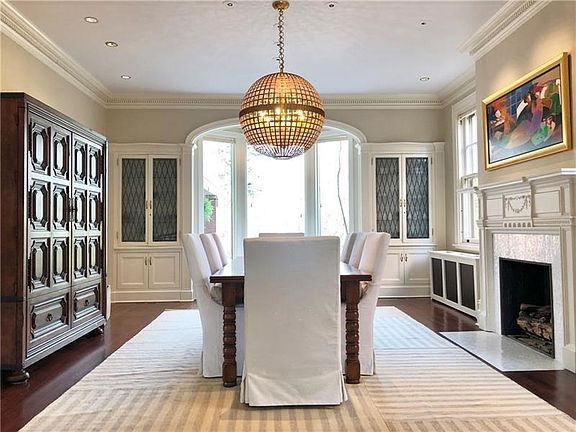 The formal dining room offers a beautiful fireplace and classic built-ins.