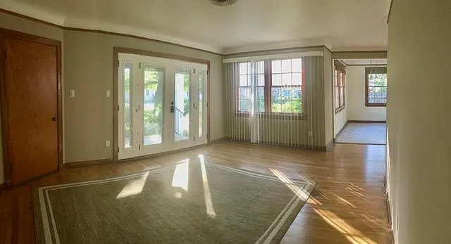 Main living room overlooking beautiful shaded front yard.