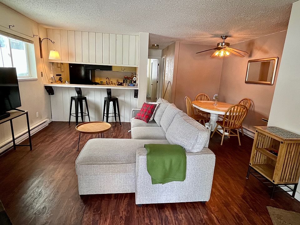 Main living area, dining, and kitchen bar.