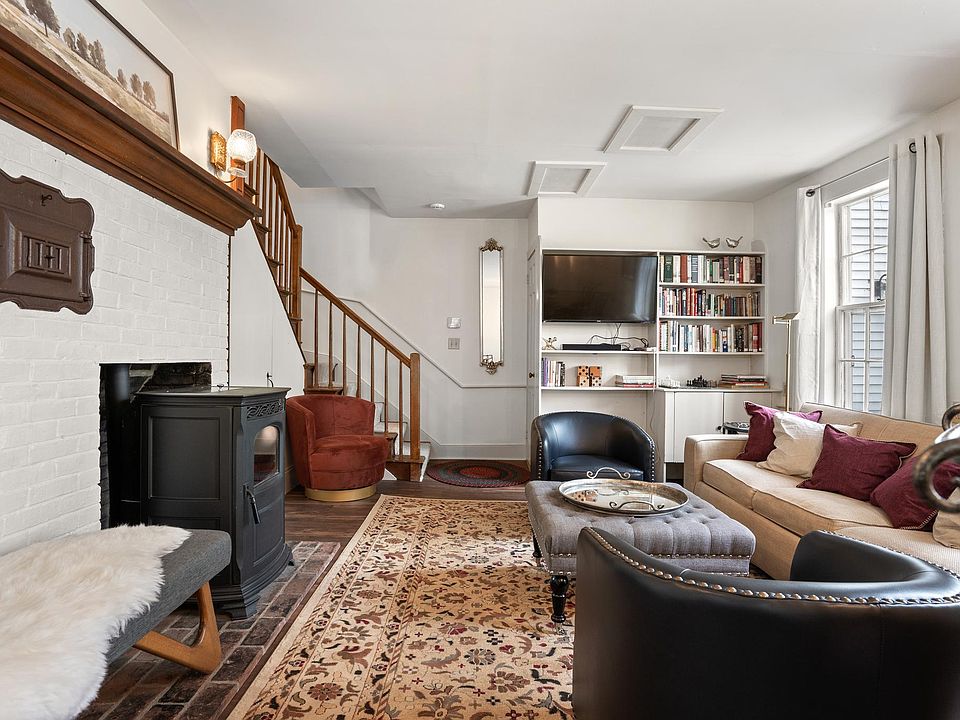 Unwind with a movie, a good book, or a game night_this inviting living room blends comfort, charm, and strong WiFi for work or play.