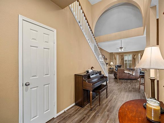 Foyer facing entry into the house. Door to the Half Bathroom is shown on left side.
