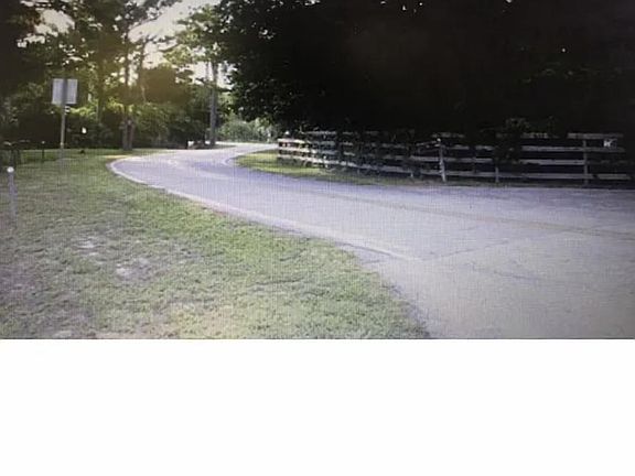 Beautiful winding road, leading you home in this fabulous neighborhood.