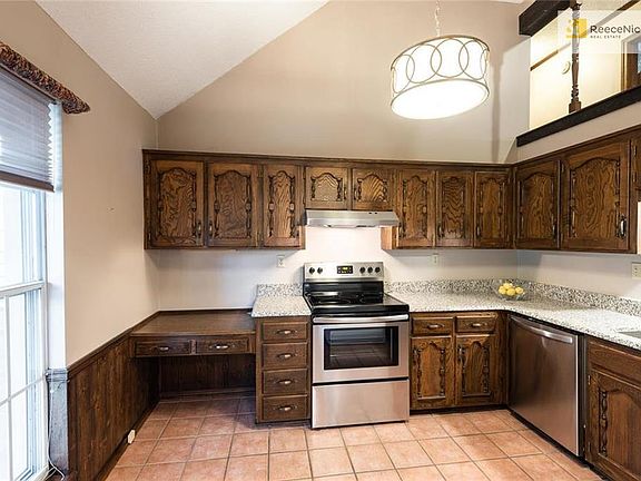 Kitchen has brand new granite countertops, stainless appliances, undermount sink and faucet, and lighting.