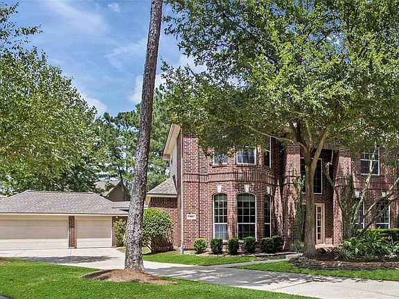 The true 3 car garage and large driveway provides lots of space for cars or recreation.