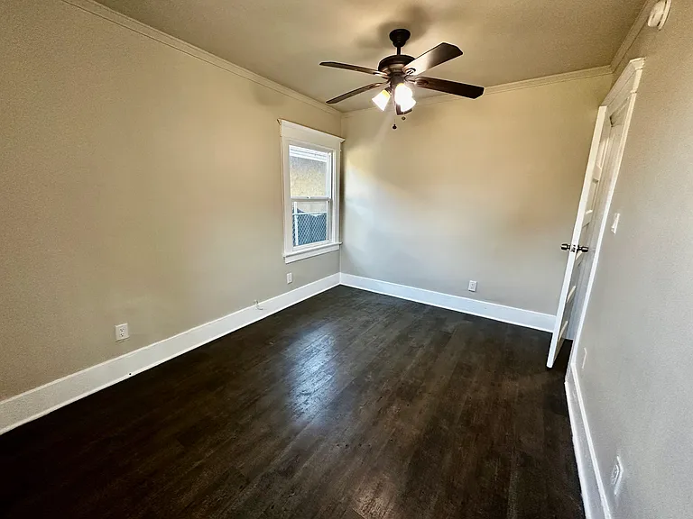 Good sized bedroom with ceiling fan and closet.