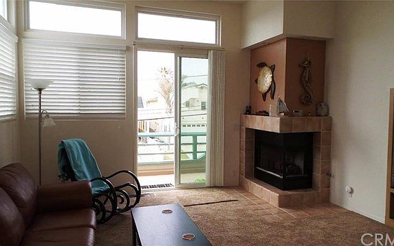 Living area, leading off to front deck and roof top ocean view area.