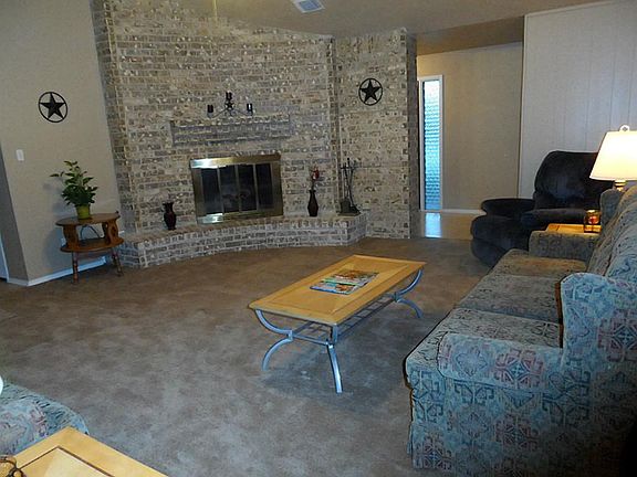 19x18 Living area with a nice brick gas-log fireplace