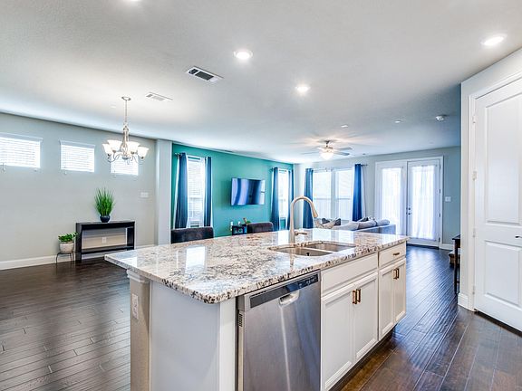 Kitchen island offers extra seating space.