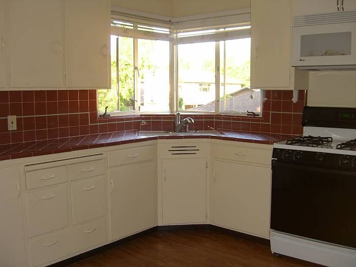 Kitchen with gas stove, microwave, fridge