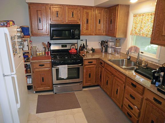 Tile floor in the kitchen with appliances included