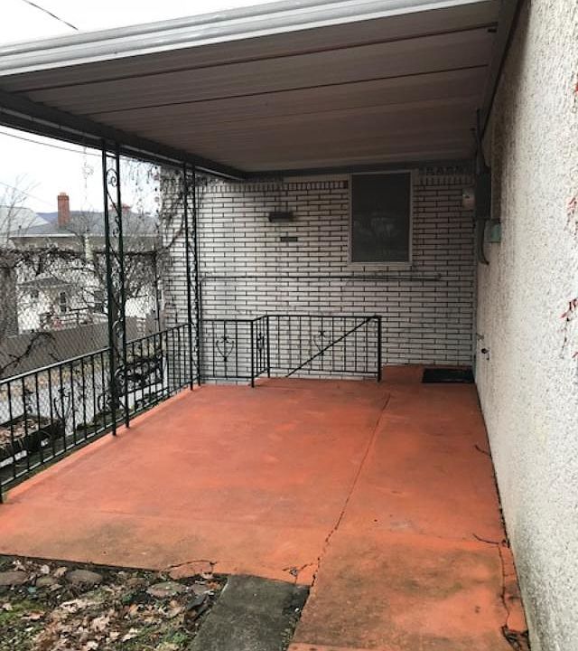 Patio view - garden area in lower left, entrance at far right