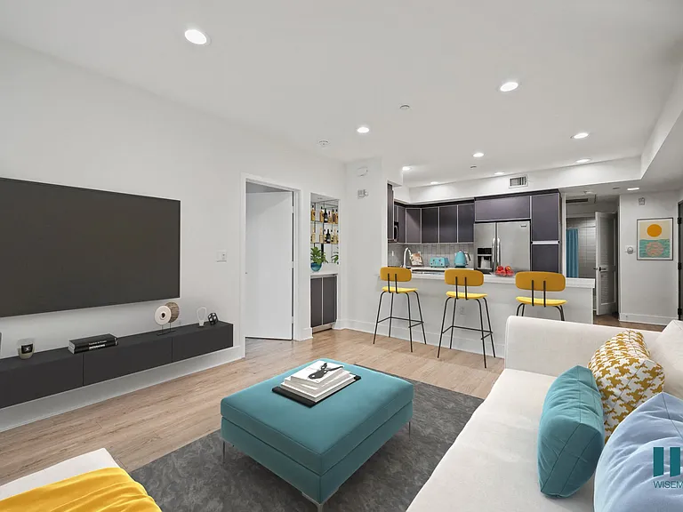 Open-Concept Kitchen with Countertop Bar and Living Room