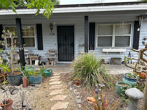 Front door of the Garden House. Come to here! Ring frog door bell. I'll show you to the Suite's entrance (through garden, around back. )