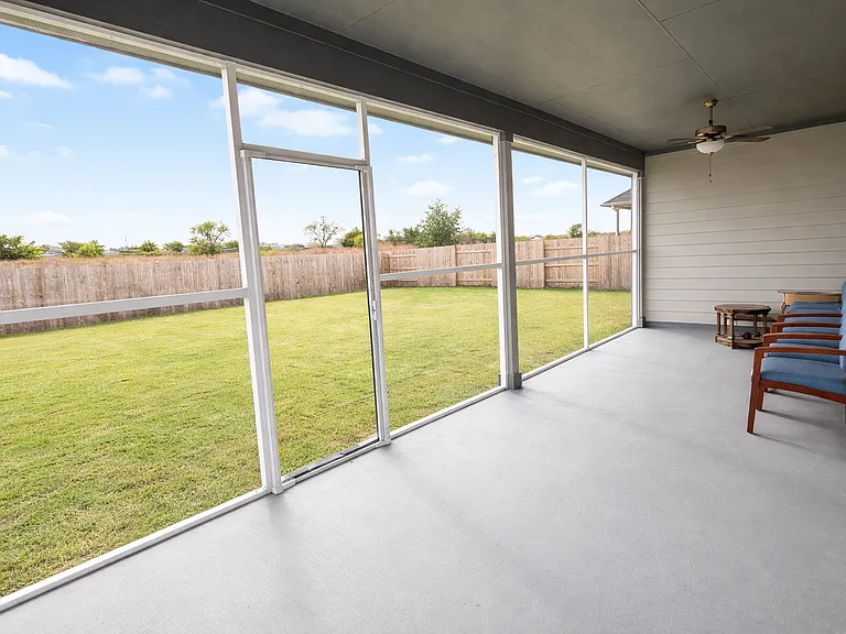 Covered & Screened back patio with painted floor