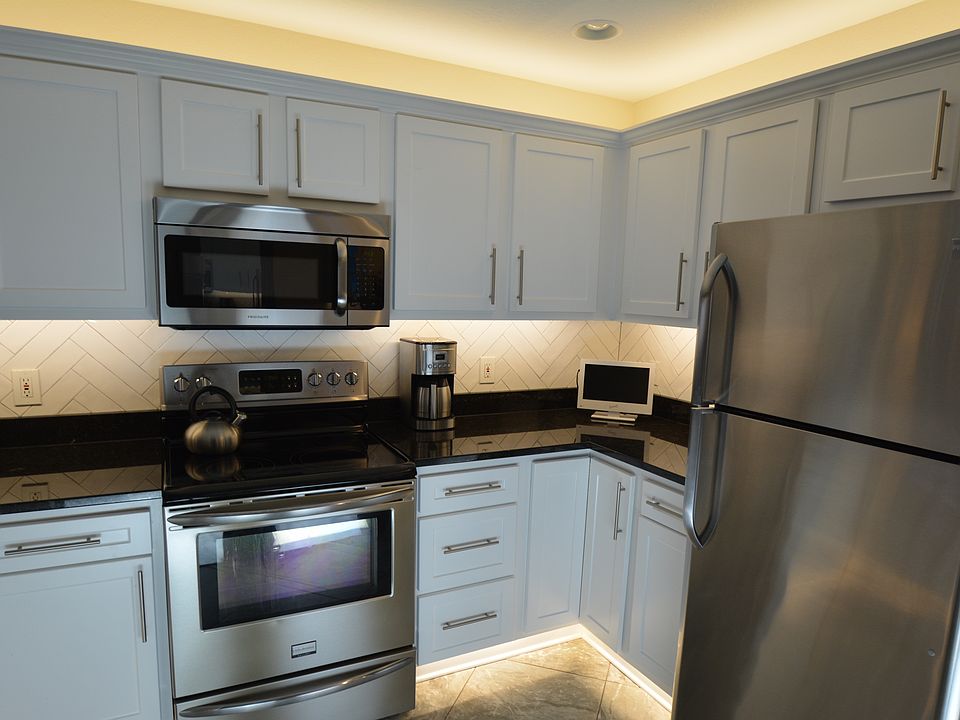 Select kitchens have tile backsplash and under & over cabinet lighting