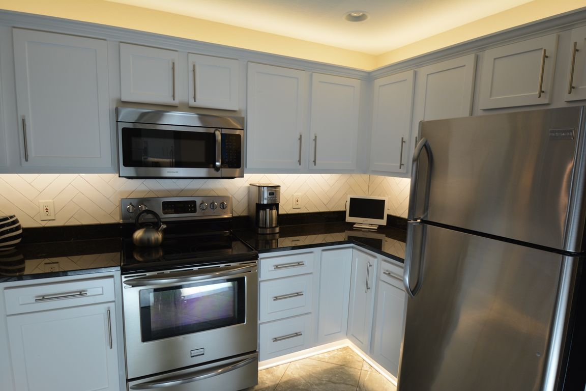 Select kitchens have tile backsplash and under & over cabinet lighting