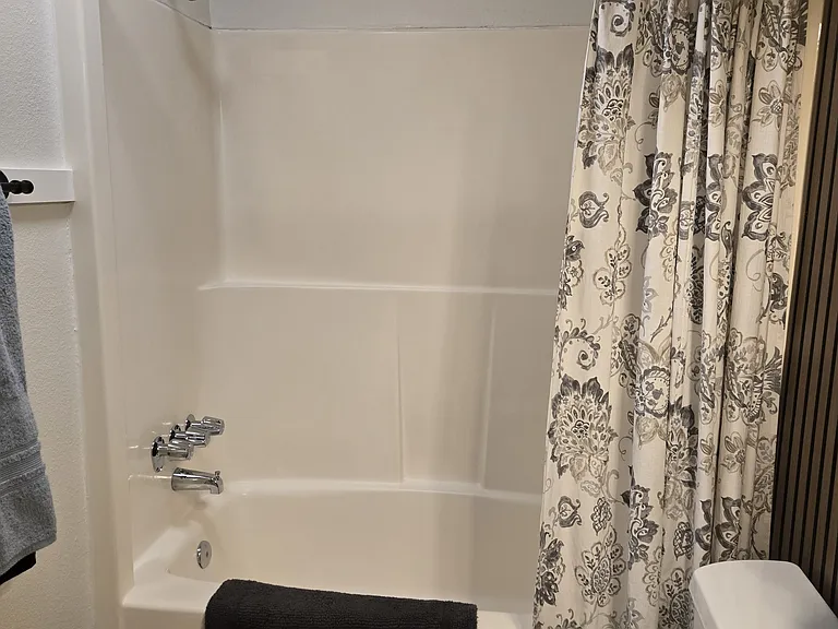 Shower curtain, towels and rugs not included.