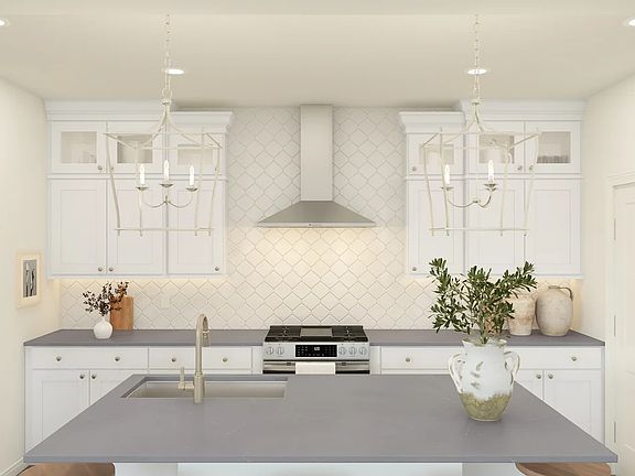 Kitchen with hexagonal backsplash and stainless steel appliances