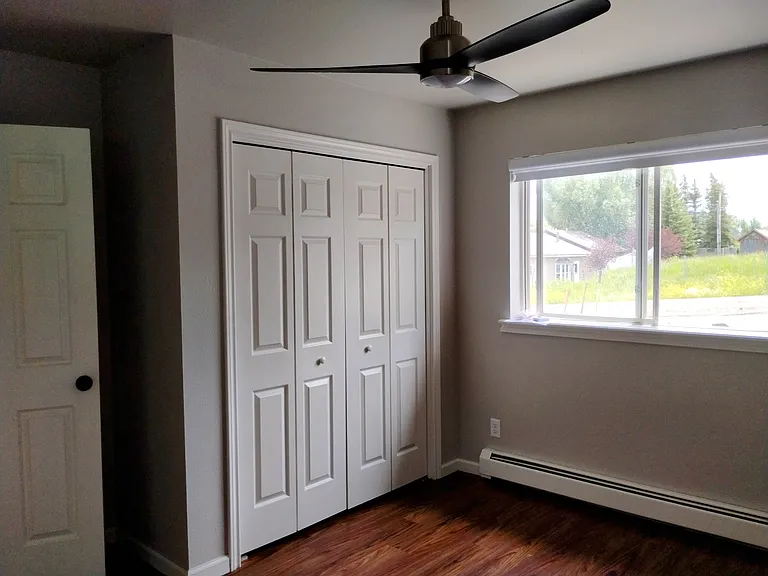 Primary bedroom with ceiling fan