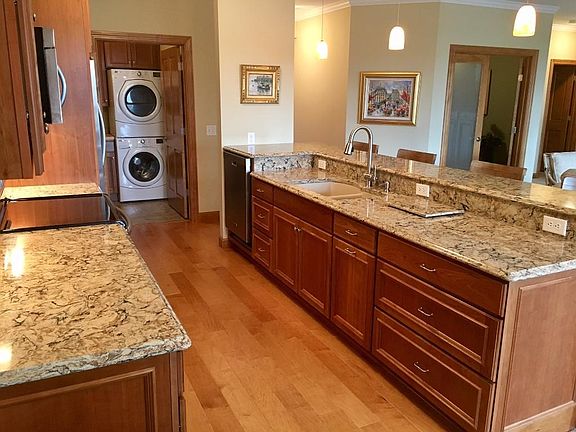 Upgraded kitchen with bar seating.