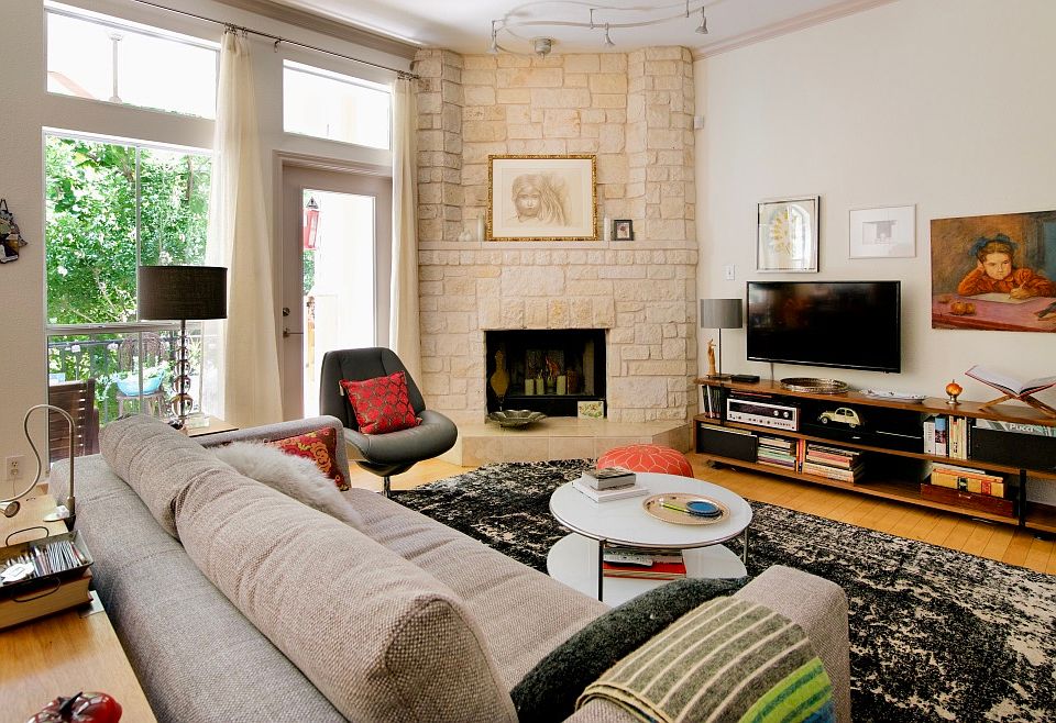 Living area with private walk out balcony nestled in the trees.